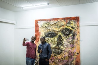 RWA RWANDA RUANDA Kigali Guests take a selfie at a regular party at the Inema Gallery. Artists,