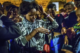 RWA RWANDA RUANDA Kigali Guests at a regular party organised by the Inema Gallery. Artists, locals
