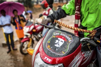 RWA RWANDA RUANDA Kigali motorbike taxi driver with Che Guevara sticker