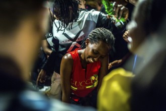 RWA RWANDA RUANDA Kigali Guests at a regular party organised by the Inema Gallery. Artists, locals
