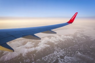 Egypt Hurghada aeroplane with Air Berlin lettering over snowy mountains