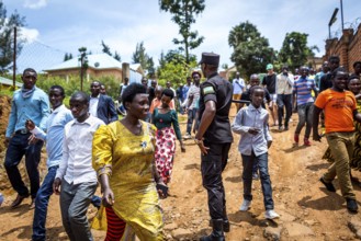 RWA RWANDA RUANDA Kigali residents, who had been waiting for the arrival of celebrities, walk