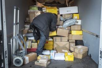 DEU Germany Germany Berlin Courier drivers load parcels and packages in front of a post office near