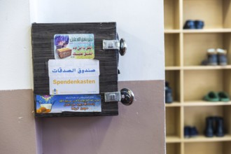 DEU Germany Germany Berlin View of the Haus der Weisheit mosque in Moabit.donation box