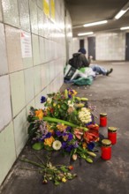 DEU Germany Germany Berlin Flowers and candles at Moritzplatz underground station, where a homeless