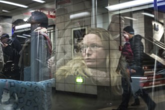 DEU Germany Germany Berlin Scenes in and around the S-Bahn.reflection of travellers
