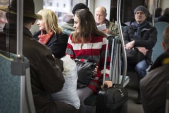 DEU Germany Germany Berlin Scenes in and around the S-Bahn.woman holding her suitcase while