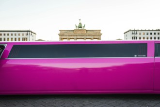 DEU Germany Germany Berlin Pink stretch limousine in front of the Brandenburg Tor