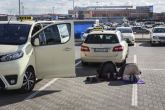 DEU Germany Germany Berlin Muslim taxi drivers pray in a car park outside Berlin-Schönefeld airport