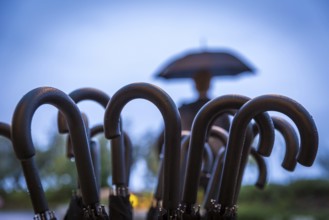 ITA Italy Castelfalfi Umbrellas in front of a hotel