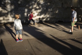 DEU Germany Germany Berlin Children play football while their parents watch a World Cup match in