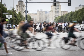 DEU Germany Germany Berlin Scene with cyclists in traffic in the capital Karl-Marx-Alle, corner of
