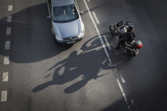 DEU Germany Germany Berlin Scene with motorcyclist on Schlossstraße in Steglitz Motorcyclist turns