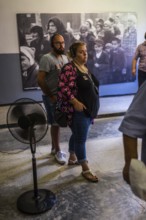 POL Poland Poland Auschwitz Visitors view photos of the Holocaust at the memorial site of the