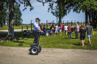 POL Poland Poland Auschwitz-Birkenau Guard on Segway in the Auschwitz-Birkenau camp