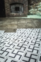 POL Poland Poland Krakow Krakow Tiles with swastikas in the exhibition of the Oskar Schindler
