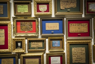 DEN Denmark Aarhus The Danish art museum Aros. Framed signs of homeless people
