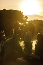 DEU Germany Germany Berlin Young tourists drink wine in the Lustgarten