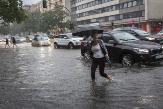 DEU Germany Germany Berlin Scene of the storm in Berlin. People cross the flooded Bundesallee