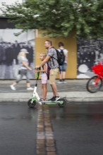 DEU Germany Germany Berlin Tourists with e-scooters at Checkpoint Charlie