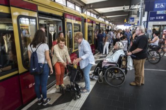 DEU Germany Germany Berlin A woman with a walker leaves the S-Bahn at Zoo station