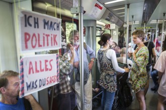 DEU Germany Germany Berlin Students discuss the G20 summit on the Berlin S-Bahn. A loose group of