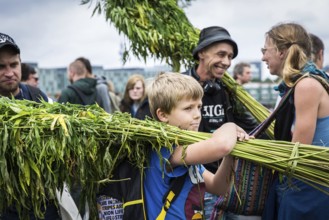 DEU Germany Germany Berlin Scene of the Hemp Parade. Child with hemp plants