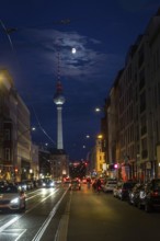DEU Germany Germany Berlin View through Brunnenstraße with TV tower and moon at the blue hour