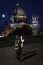 DEU Germany Germany Berlin Women photographing themselves in front of Berlin Cathedral with the