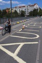 DEU Germany Germany Berlin Cyclists pass the closed Monumentenbrücke bridge in Schöneberg. The