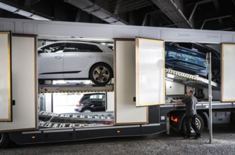 DEU Germany Germany Berlin SUVs with electric motors are loaded onto a transporter in Kantstrasse.