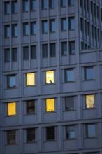DEU Germany Germany Berlin A man sits in an illuminated office in the Beisheim Centre