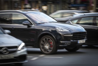 DEU Germany Germany Berlin An SUV, Porsche Cayenne, takes off on the Kudamm