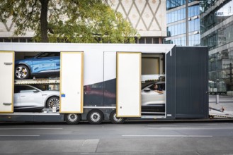 DEU Germany Germany Berlin SUVs with electric motors are loaded onto a transporter in Kantstrasse.