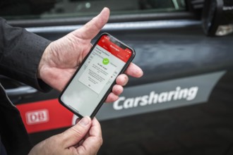 DEU Germany Germany Berlin Carsharing Flinkster with the Deutsche Bahn mobile phone app