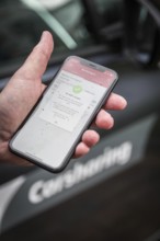 DEU Germany Germany Berlin Carsharing Flinkster with the Deutsche Bahn mobile phone app