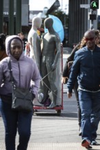 DEU Germany Germany Berlin Pedestrians crossing a street at Potsdamer Platz where mannequins are
