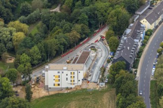 Aerial view, construction site, new multi-family house with day care centre,