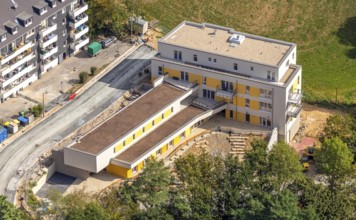 Aerial view, construction site, new multi-family house with day care centre,
