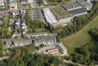 Aerial view, construction site, new multi-family house with day care centre,