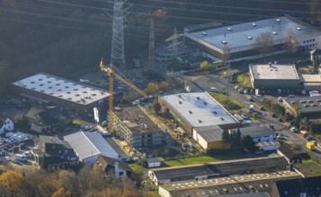 Aerial photo, construction site, construction crane, new building, electricity pylons,