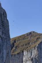 Tour d'Aï and Tour de Mayen with tightrope artist, Leysin, Vaud, Switzerland