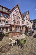 Marienbrunnen, stone fountain, historic half-timbered houses, buildings, bicycles, square made of