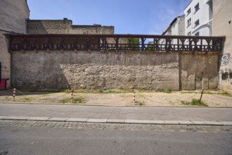 City fortification, historic city wall, general architecture, houses, parking lot, barrier bollard,