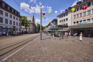 Schillerplatz tram stop, bakery backwerk, overhead lines, general architecture, houses, residential