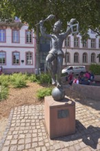 Bajazz with the lantern, metal sculpture, sculptor Inge Blum, paving stone walkway, historic