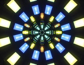 Abstract background of slightly unfocused multicolored glass lenses spinning and rotating,