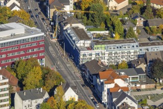 Aerial view, senior campus construction site with new building and façade scaffolding on Werler