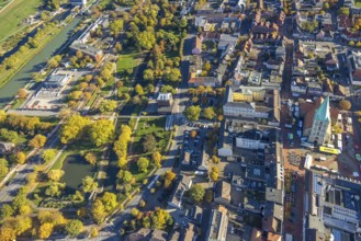 Aerial view, city and evangelical St. Paul's Church and educational center, weekly market market on