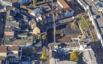 Aerial view, city with construction site with demolition and new construction of the western half